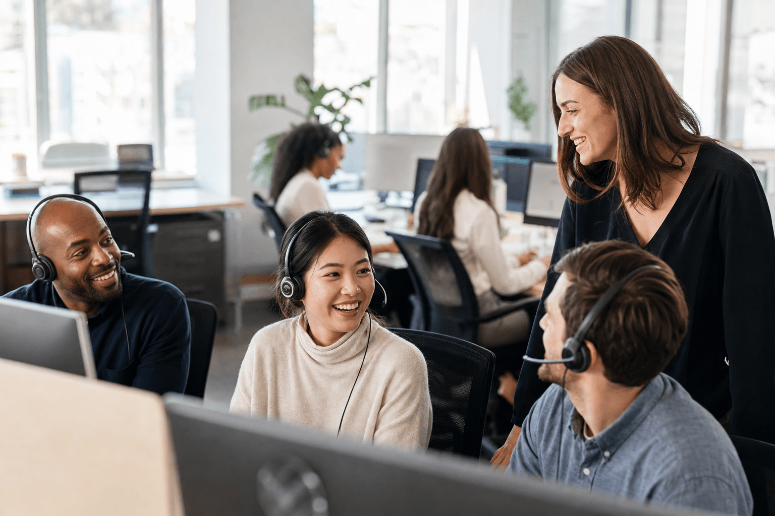 Customer service team collaborating in a modern office